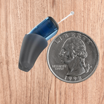 Hearing Aid compared to a dime